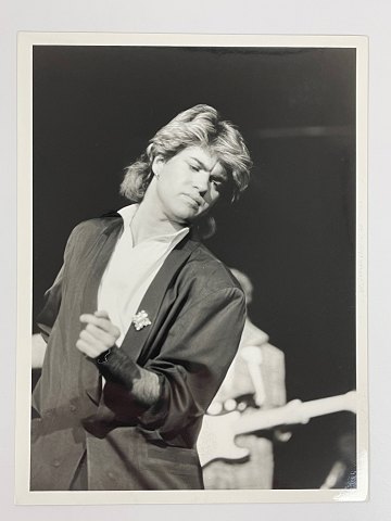 Original black and white press photo of George Michael of Wham during the latter