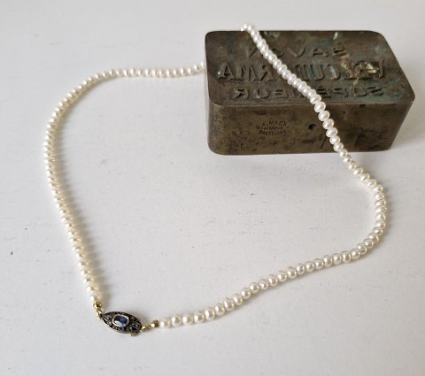 Freshwater pearl with antique sapphire and diamond in gold & silver