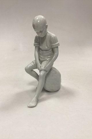 Royal Copenhagen Blanc de Chine Figurine - Boy on Stone No. 520