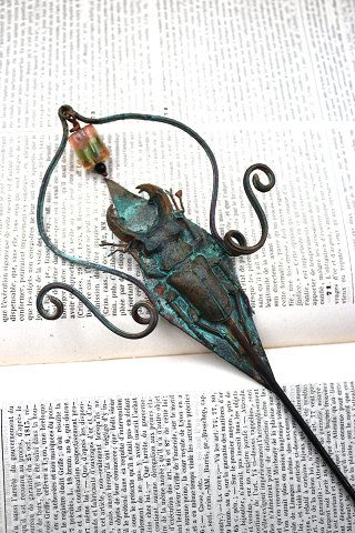 Unique flower stick in copper with glass bead and insect made by jewelry artist Torben Hardenberg...