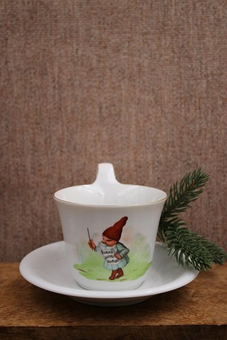 High-handled cup with Christmas motif and gold rim from Bing & Grondahl.