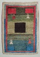 Swedish textile designer. Carpet in pure wool. Handwoven.Designed with figures and geometric fields in various colors.