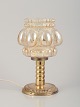 Helena Tynell, finsk glaskunstner, for Limburg.Designer bordlampe i klart glas og metal.