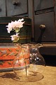 Old mouth-blown glass vase with wavy edge...