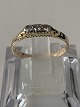 Gold ring in 14 carat gold, with three diamonds, stamped EC 585. Ring size: 58