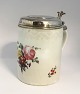 Royal Copenhagen. Lidded mug decorated with flowers with silver lid. Lid not stamped. Height 17 cm. Diameter 12 cm