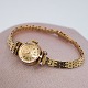 Rolex; Orchid watch in 18k gold with diamonds, with chain in 14k gold