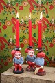 Cute little Santas with geese on their backs in painted plaster with a candle holder at the top...