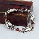 Georg Jensen; "Moonlight Blossom" armbånd af sterling sølv med granat, nr. 11