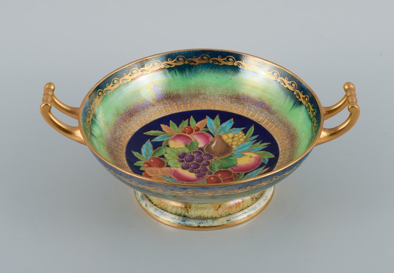 Mintons, England, porcelain bowl with handle. Hand painted with fruits and decorated with gold leaf.