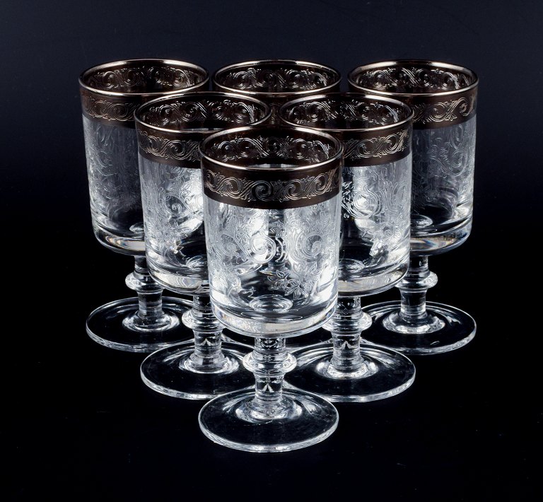 Murano, Italy, six mouth-blown and engraved dessert wine glasses with silver rim.