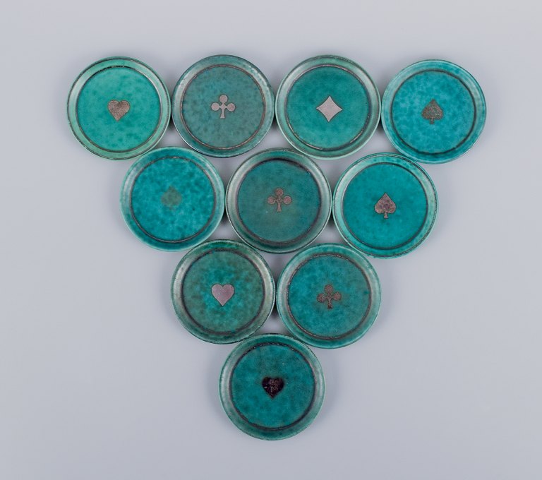 Wilhelm Kåge for Gustavsberg, Sweden. A set of ten "Argenta" coasters/bottle trays.