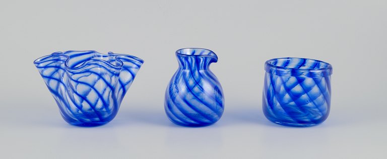 Glashytten, Nykøbing Sjælland, DenmarkBowl, vase, and pitcher in mouth-blown art glass. Blue hues.
