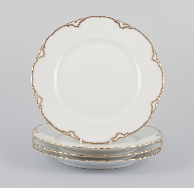 Et s&#230;t p&#229; fire Haviland middagstallerkener af porcel&#230;n.