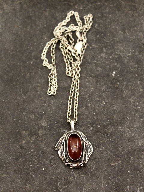 Sterling silver pendant with amber
